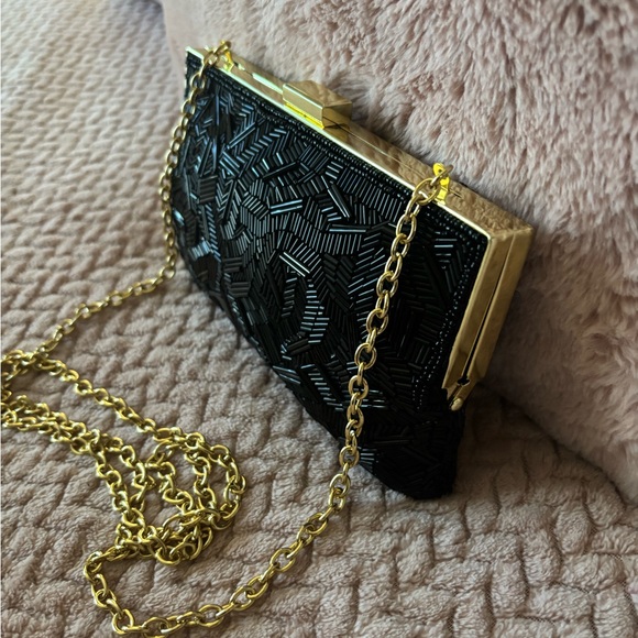Elegant Black Clutch Bag with Gold Chain - Picture 1 of 9